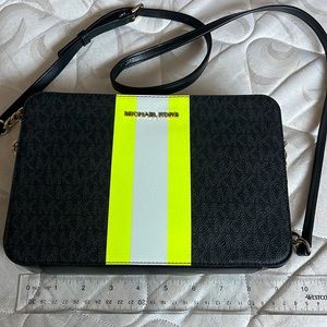 Black crossbody with yellow and grey stripes